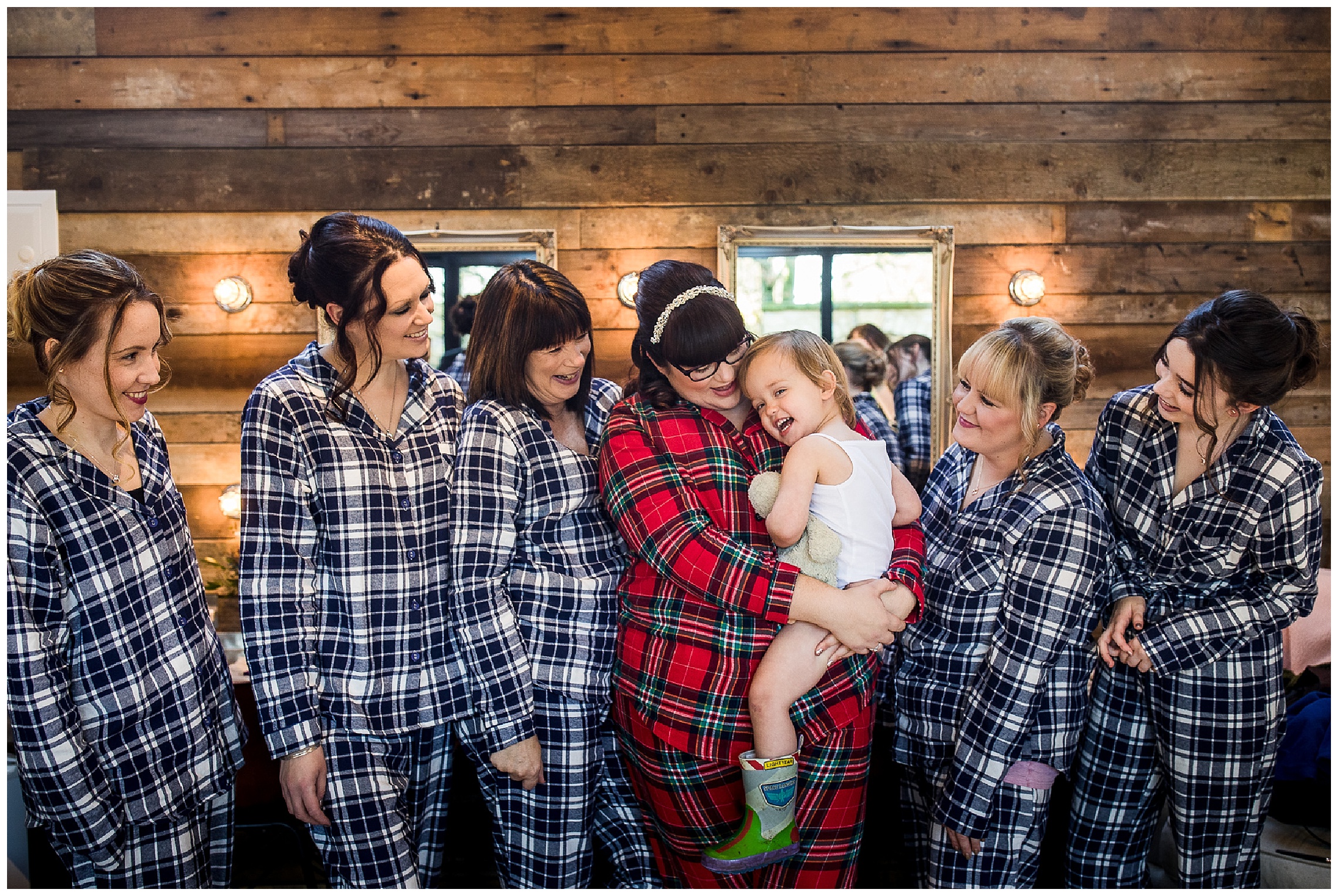 bridal party with flower girl wearing matching pyjamas in bridal nook