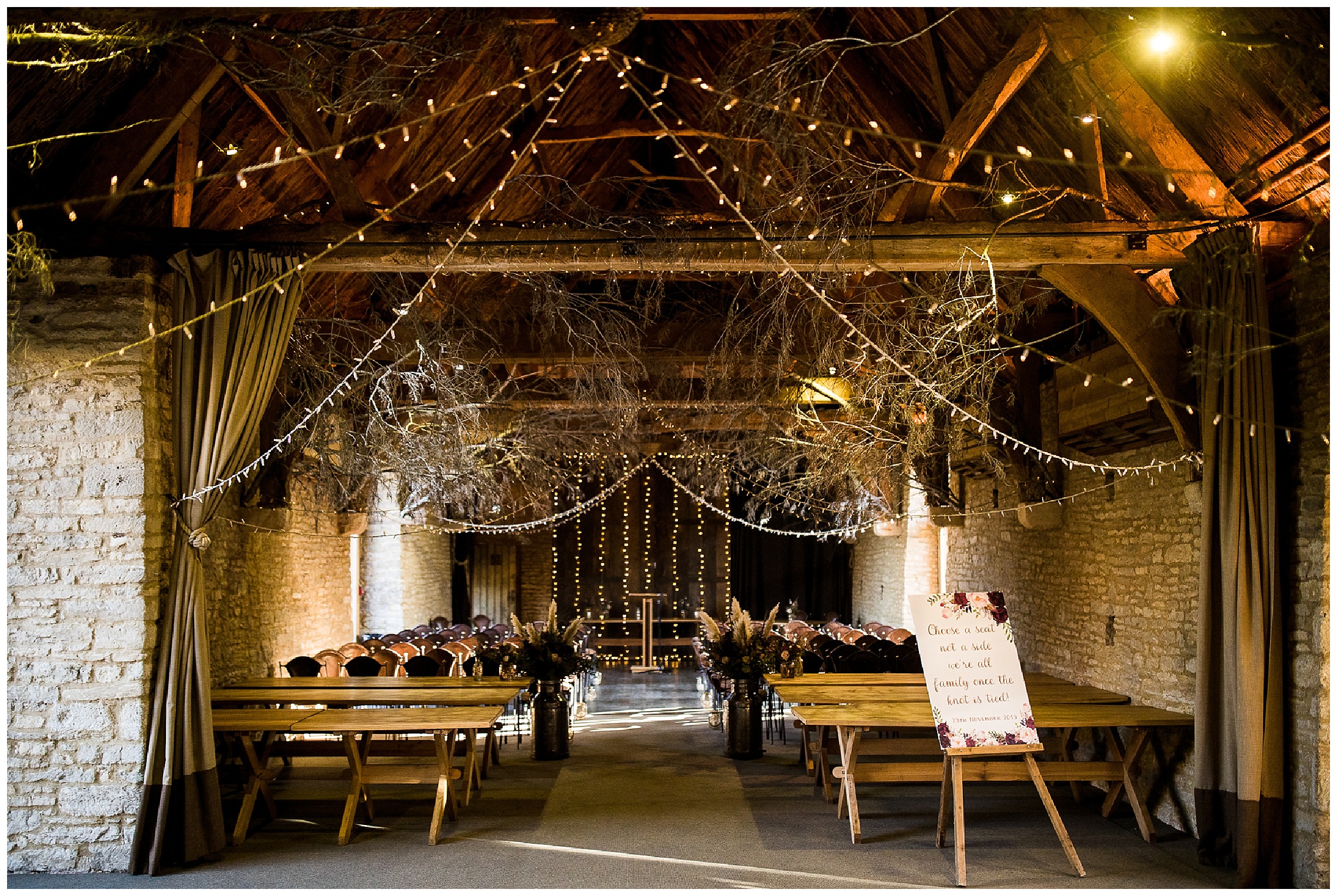tythe barn wedding venue with fairy lights and twigs