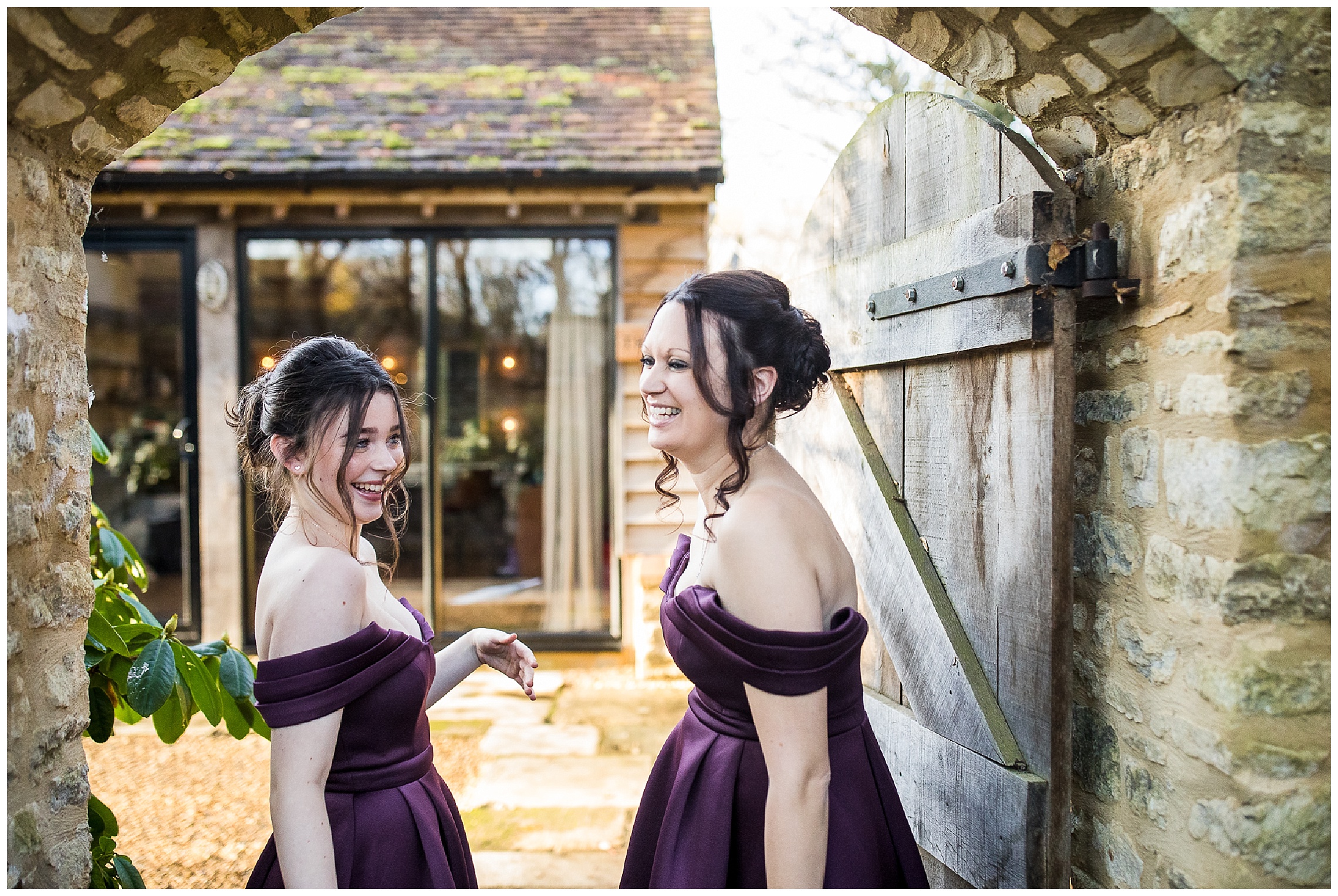 bridesmaids in purple dresses wait outside bridal nook