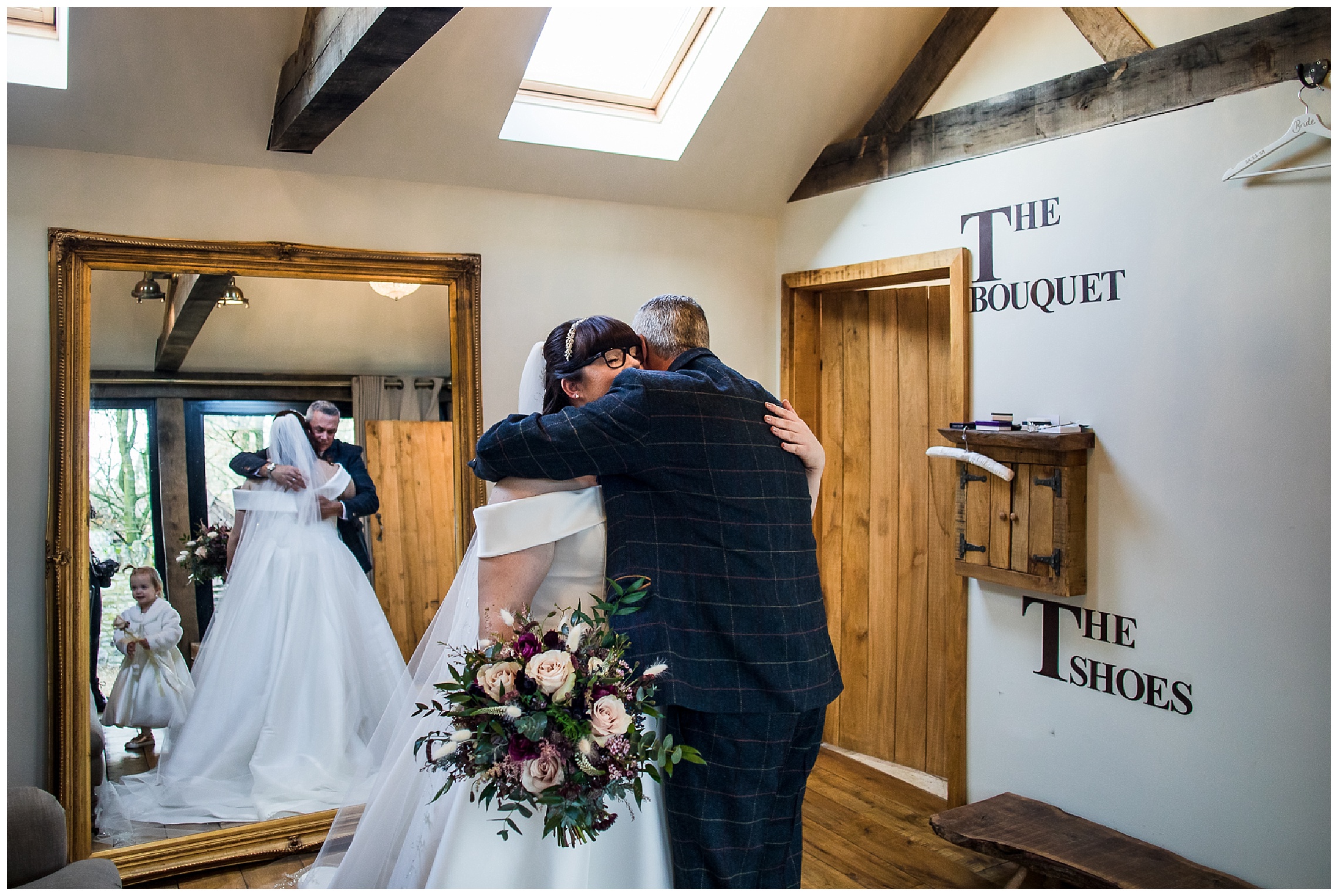 bride cuddling her dad in bridal nook tythe barn in launton