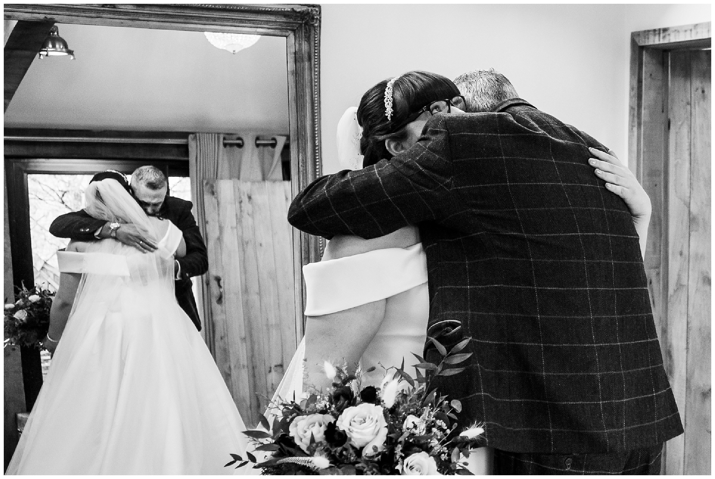 bride and her father have an emotional moment together