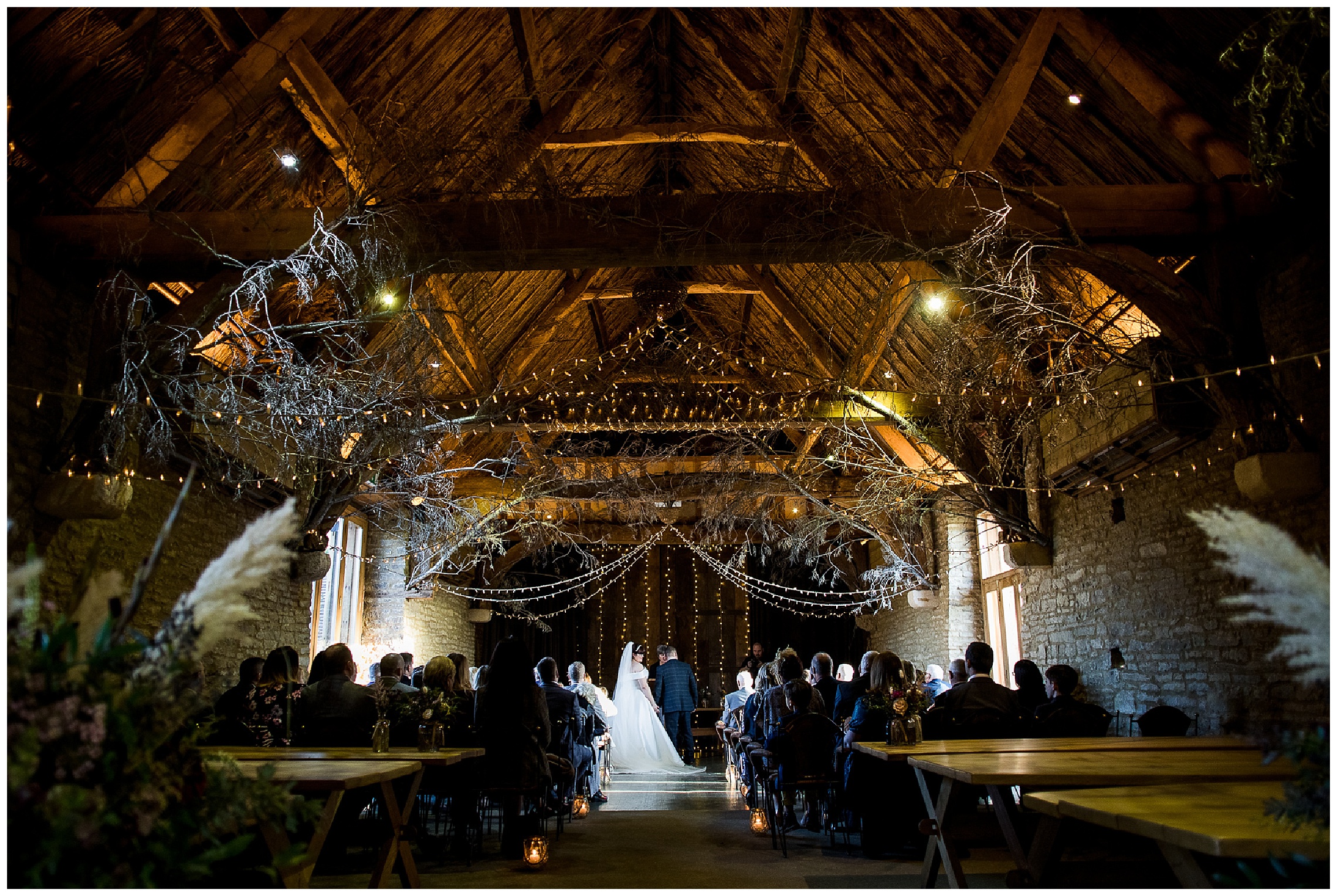 tythe barn in launton wedding ceremony with fairy lights