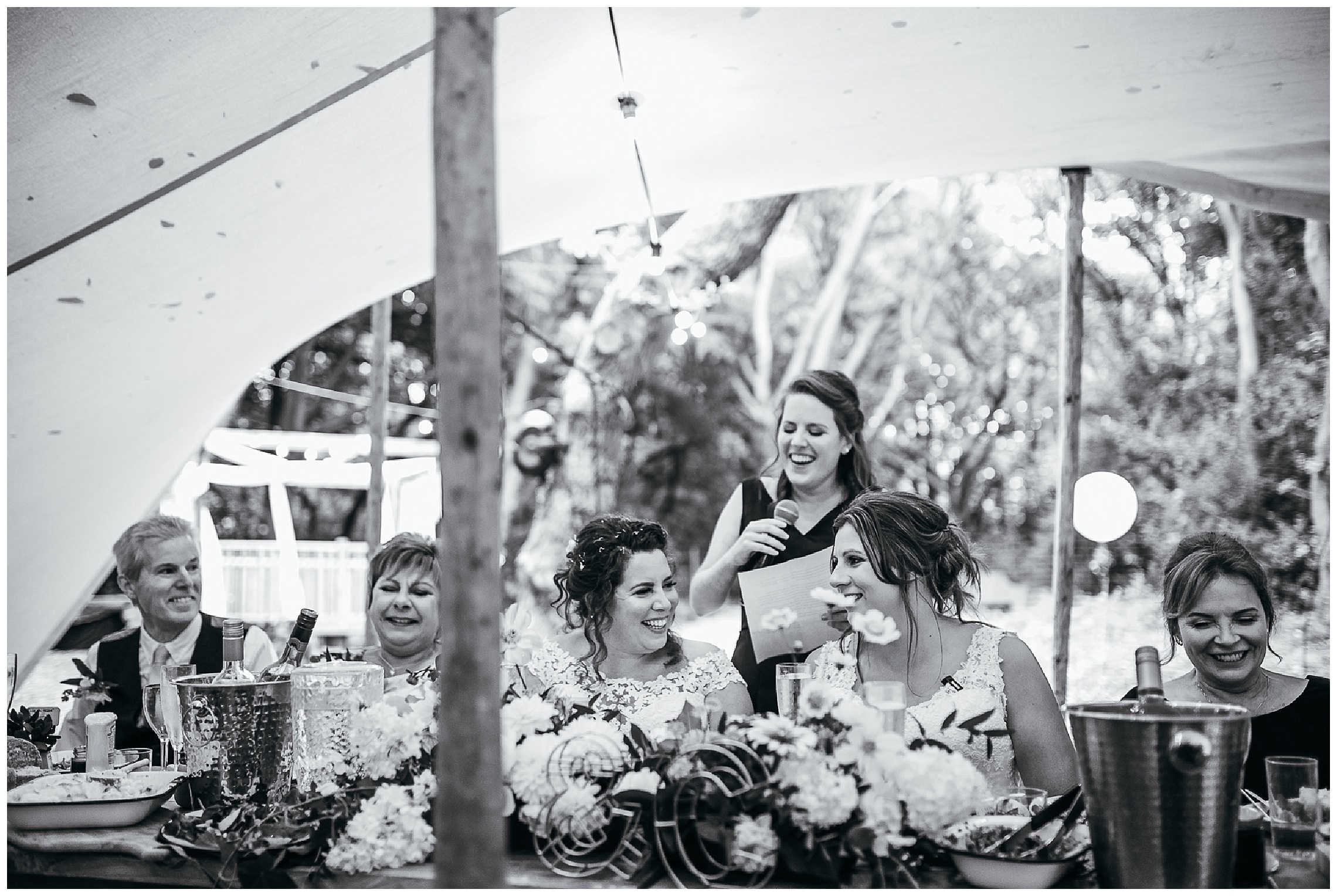 brides laughing during speeches