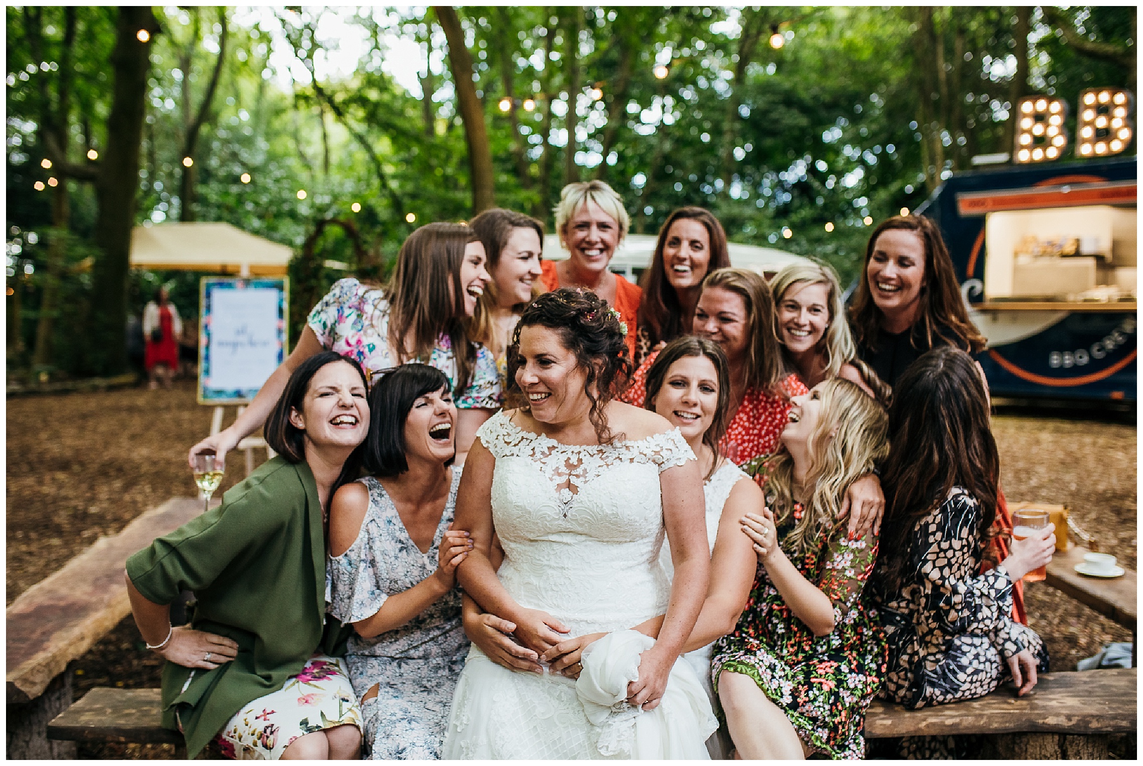 brides surrounded by her friends laughing