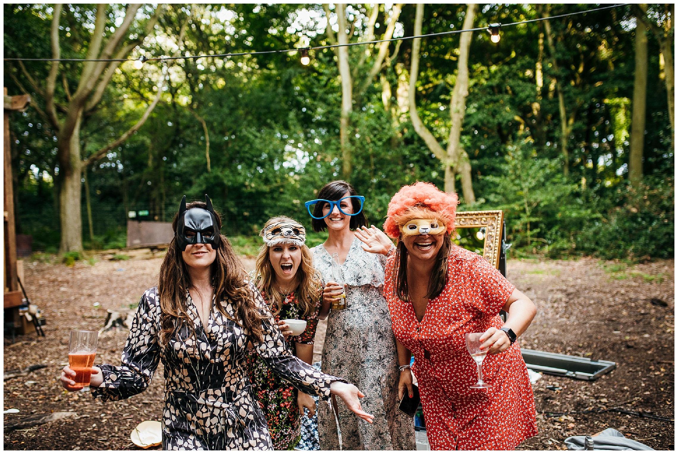 guests wear Photo Booth props and laugh