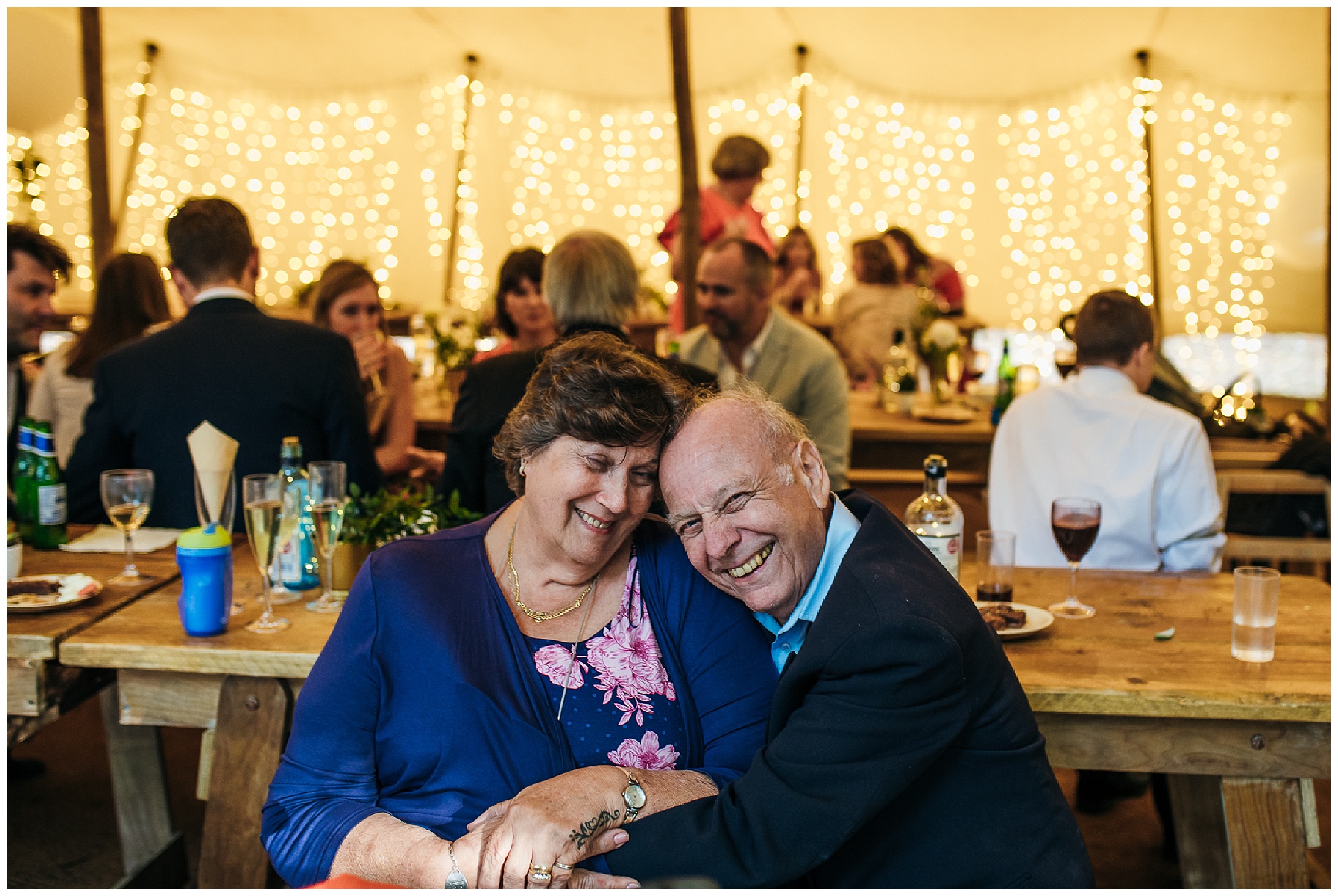 wedding guests cuddling in tipi