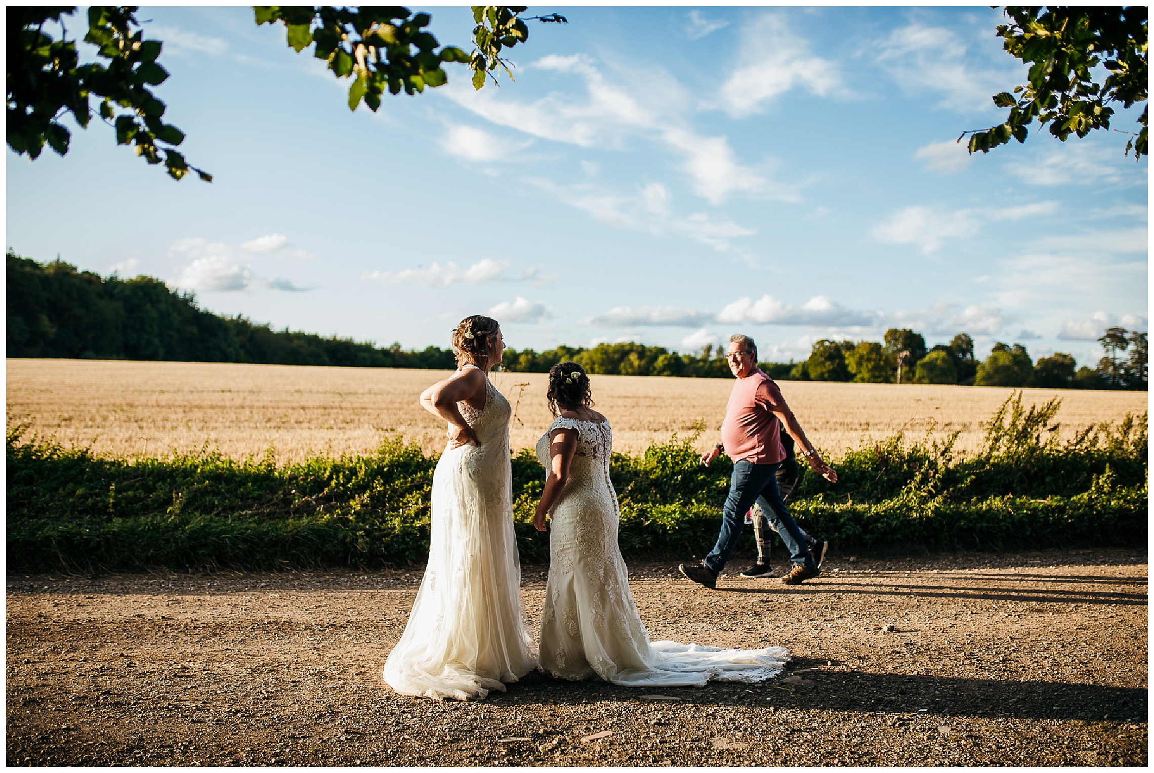 brides wave at dog walkers