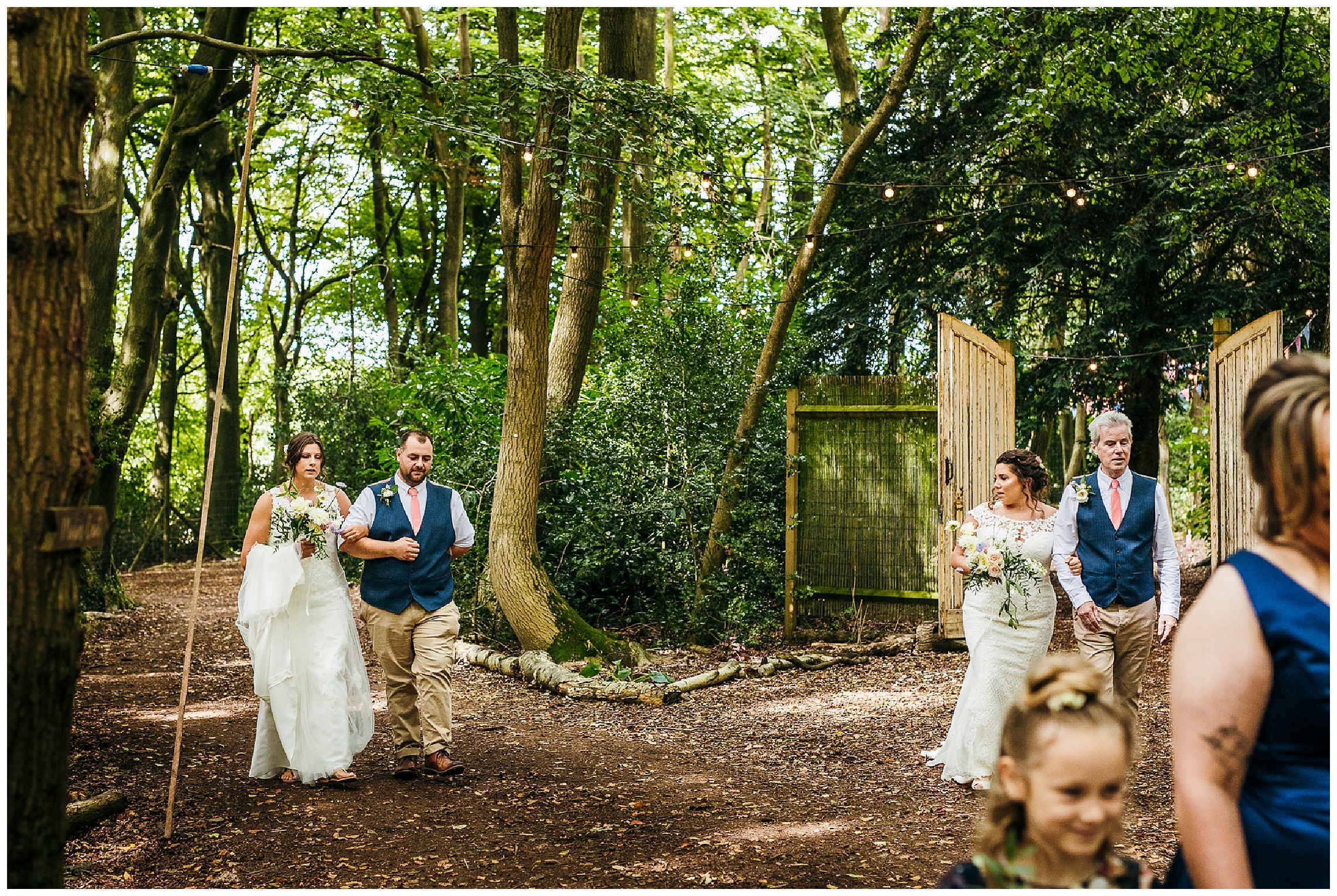 brides walking towards one another at outdoor setting lilas wood
