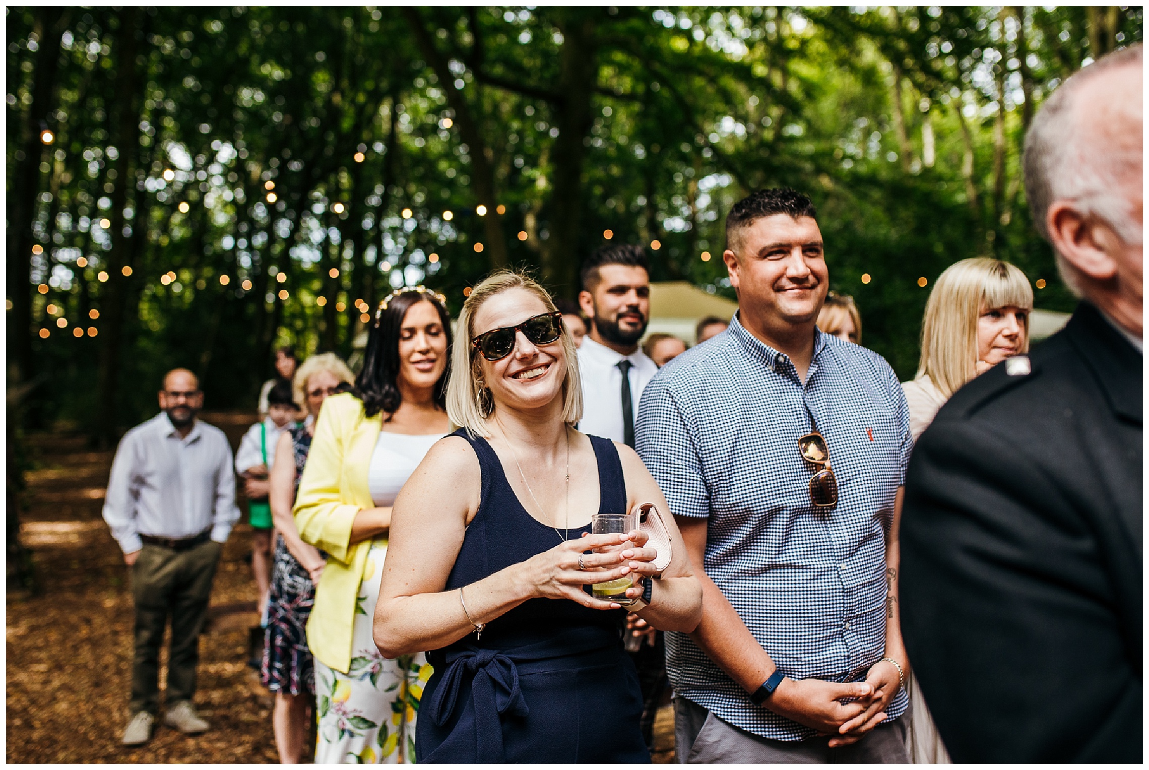wedding guests smiling in sunglasses
