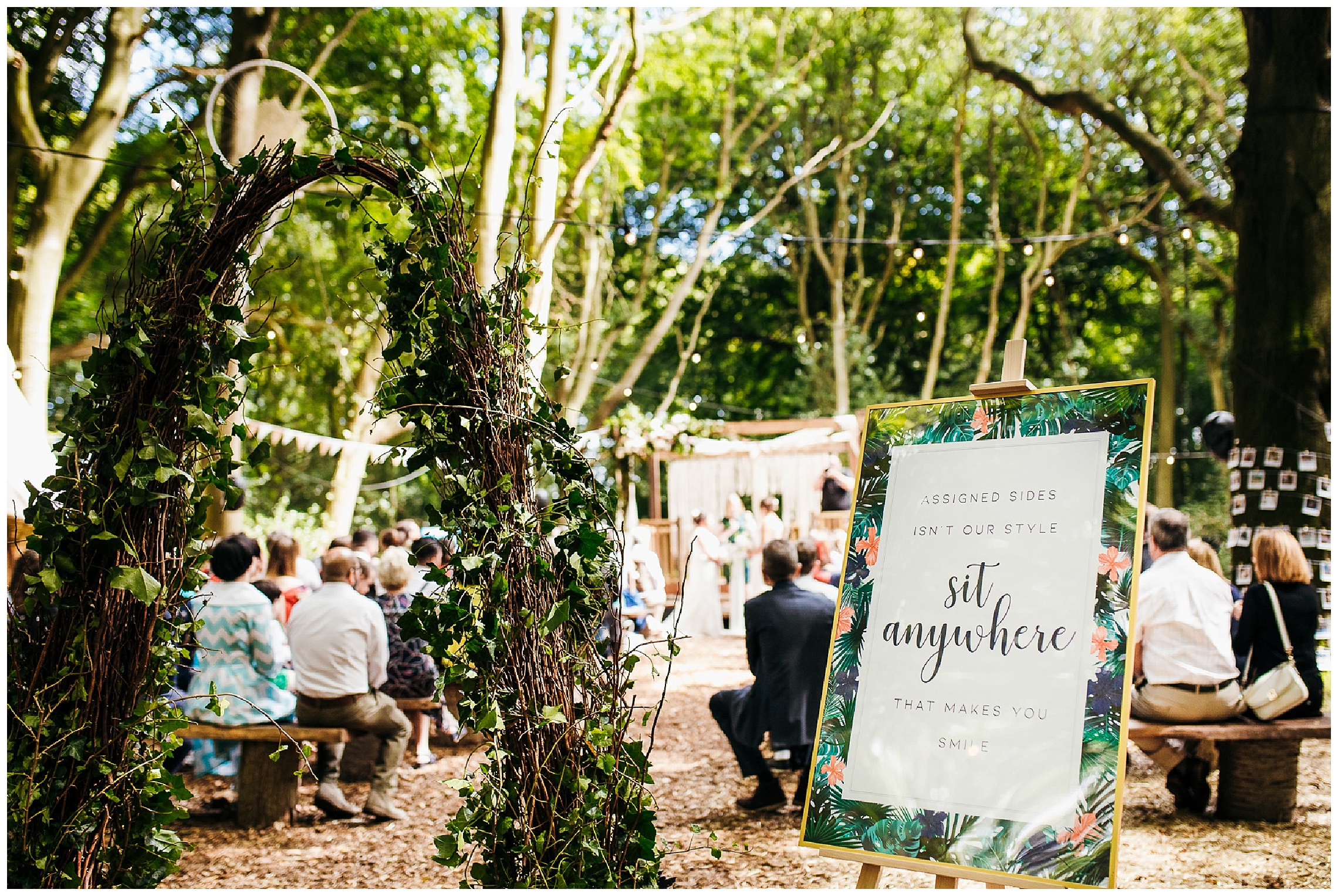 woodland weddings outdoor ceremony with archway and tropical style stationary