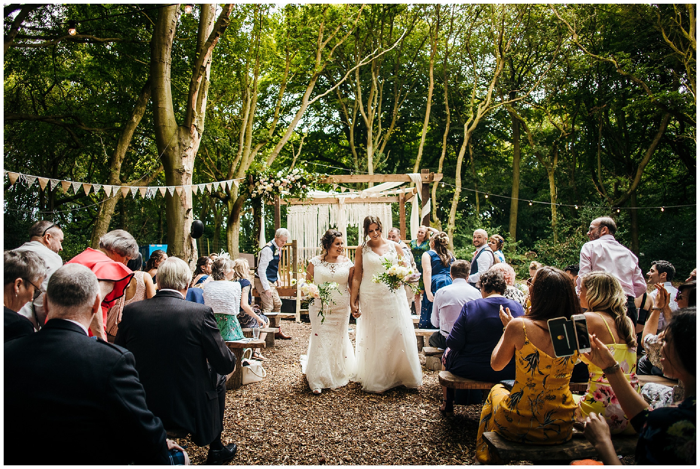 brides walk down aisle happily married at woodlands weddings