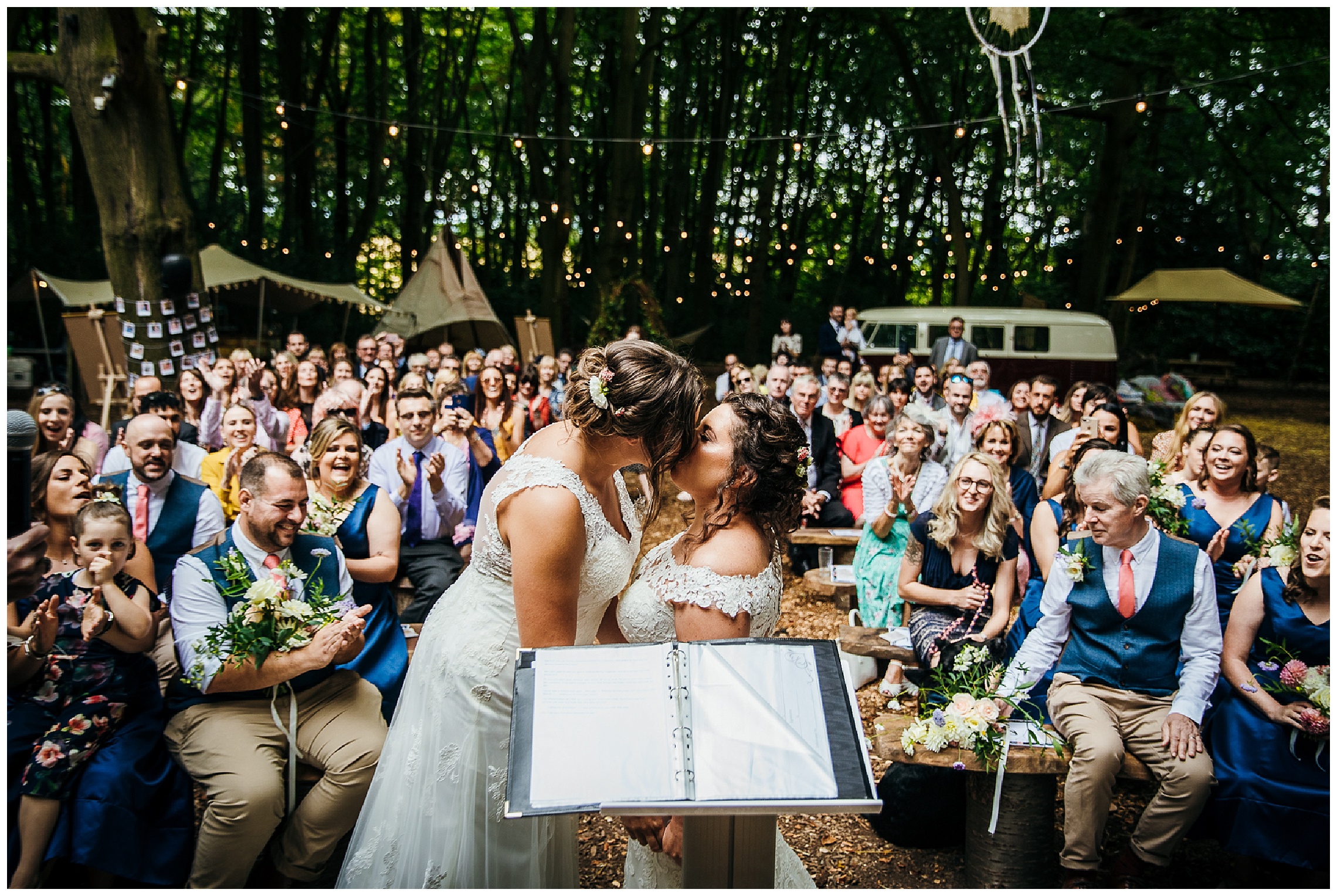 brides kiss after wedding ceremony at lilas wood