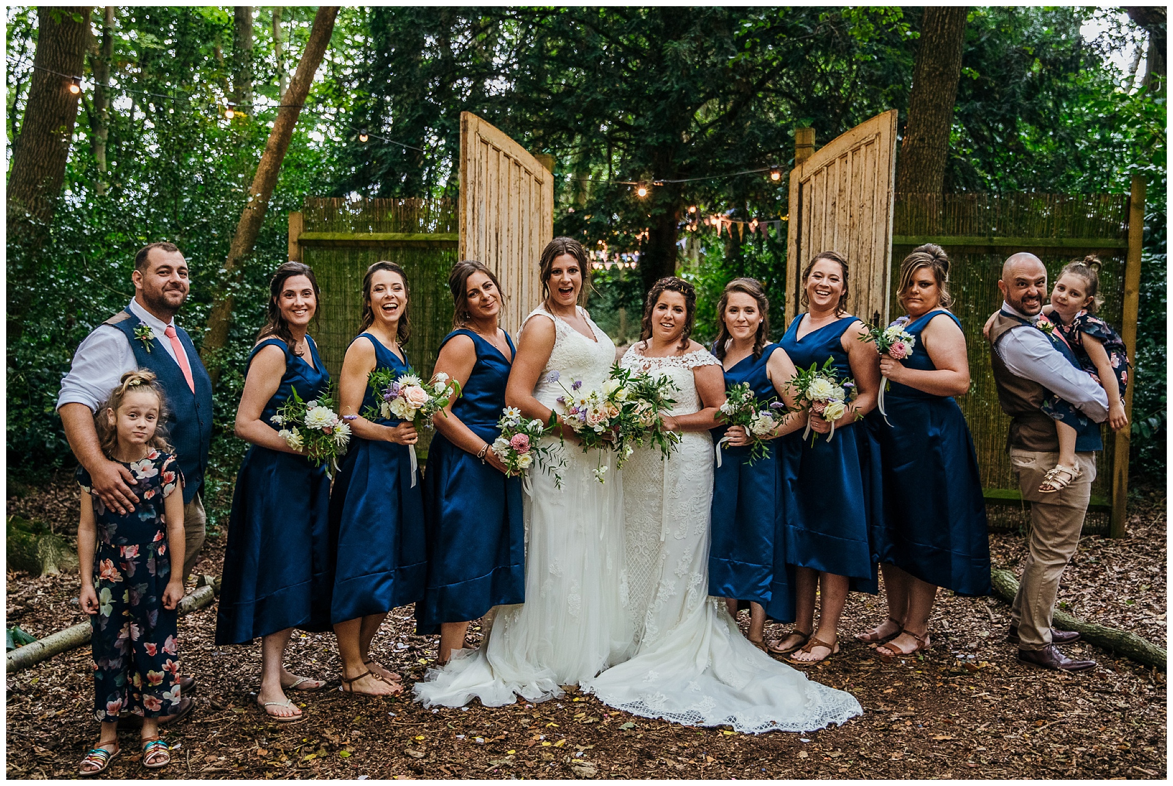 brides and their bridesmaids in calf midi length blue dresses