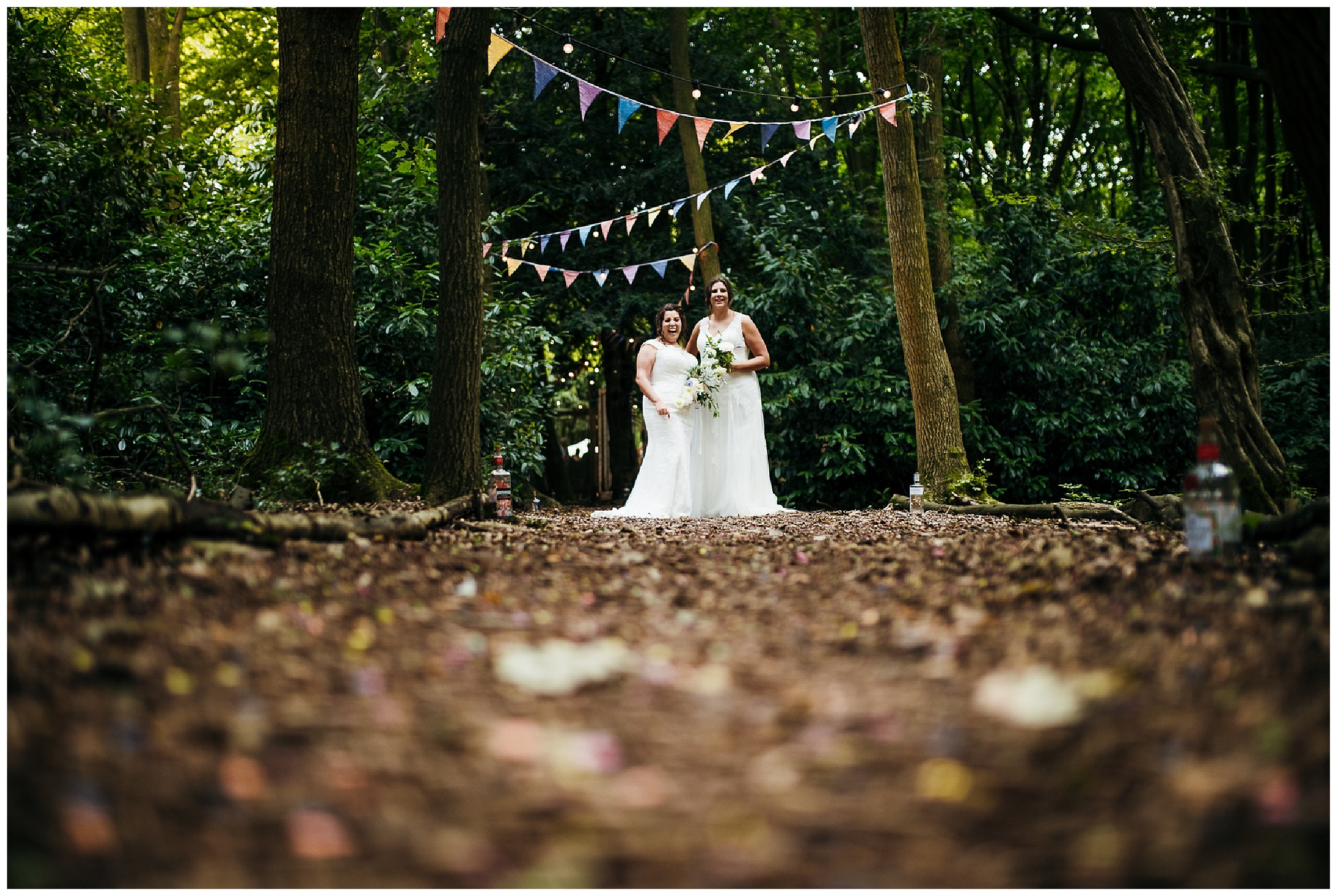 brides laugh whilst holding onto flowers at woodland weddings lilas wood