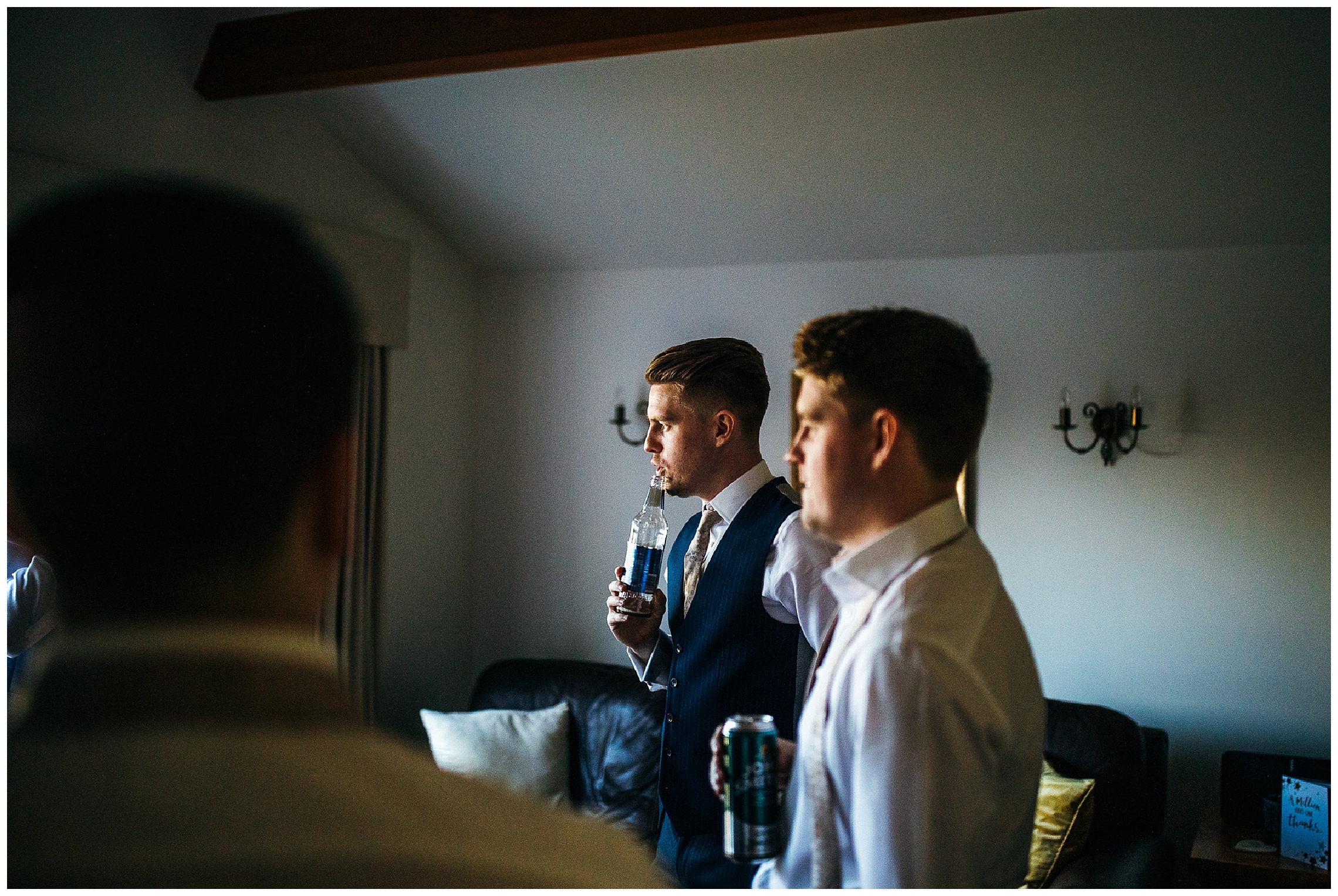 groom and brother looking out of window