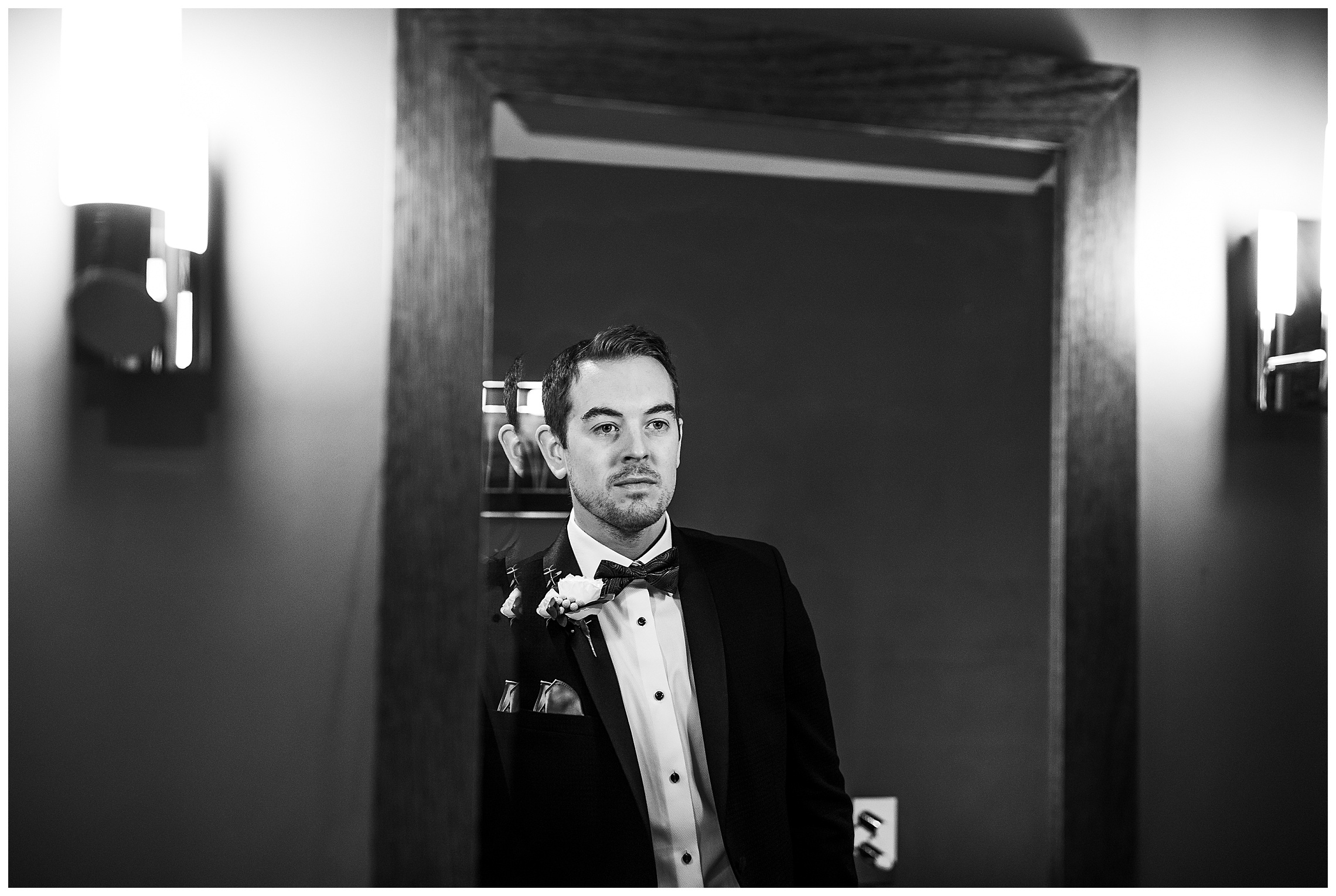 reflection of groom in black suit at bassmead