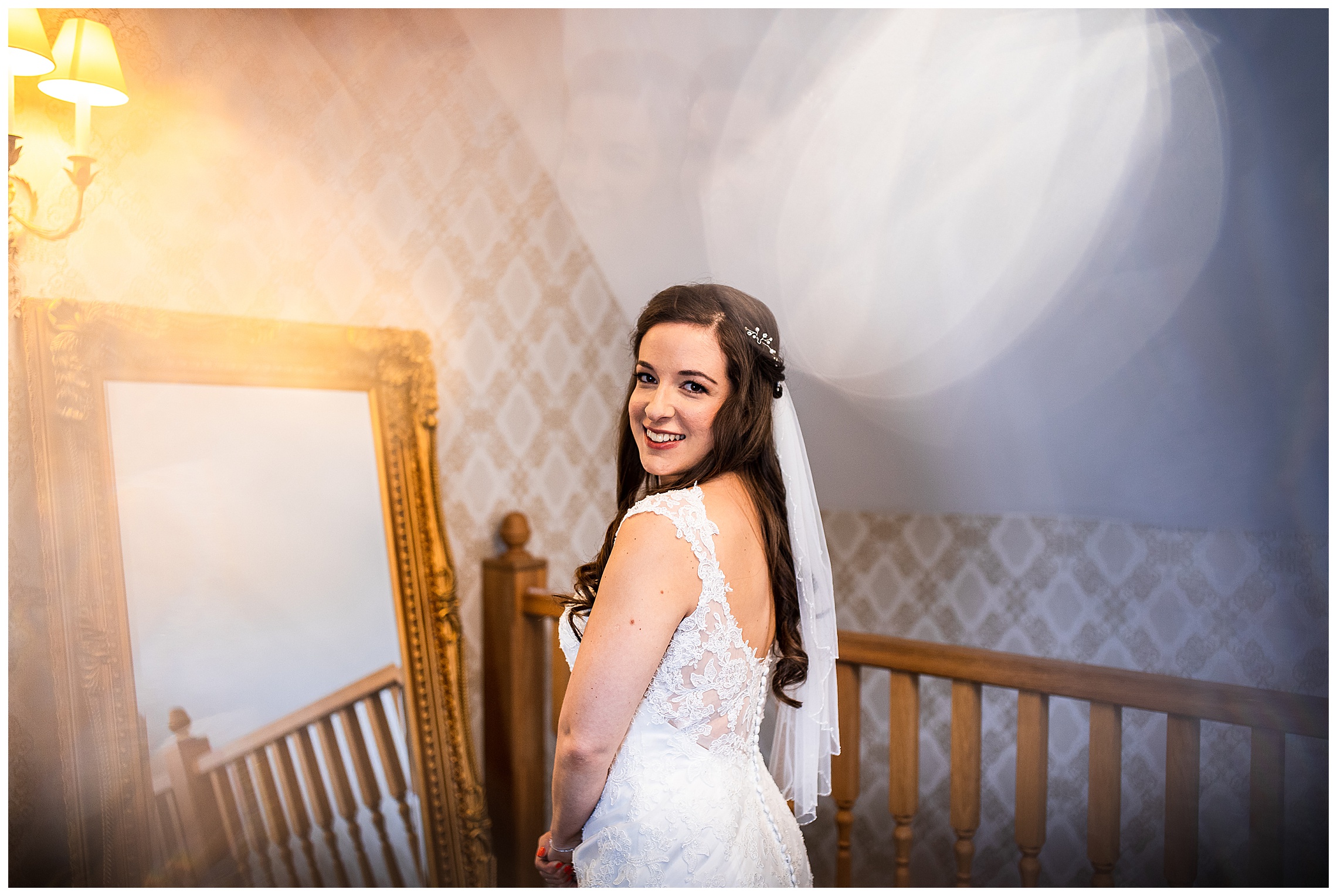 bride looking over her shoulder in wedding dress and veil