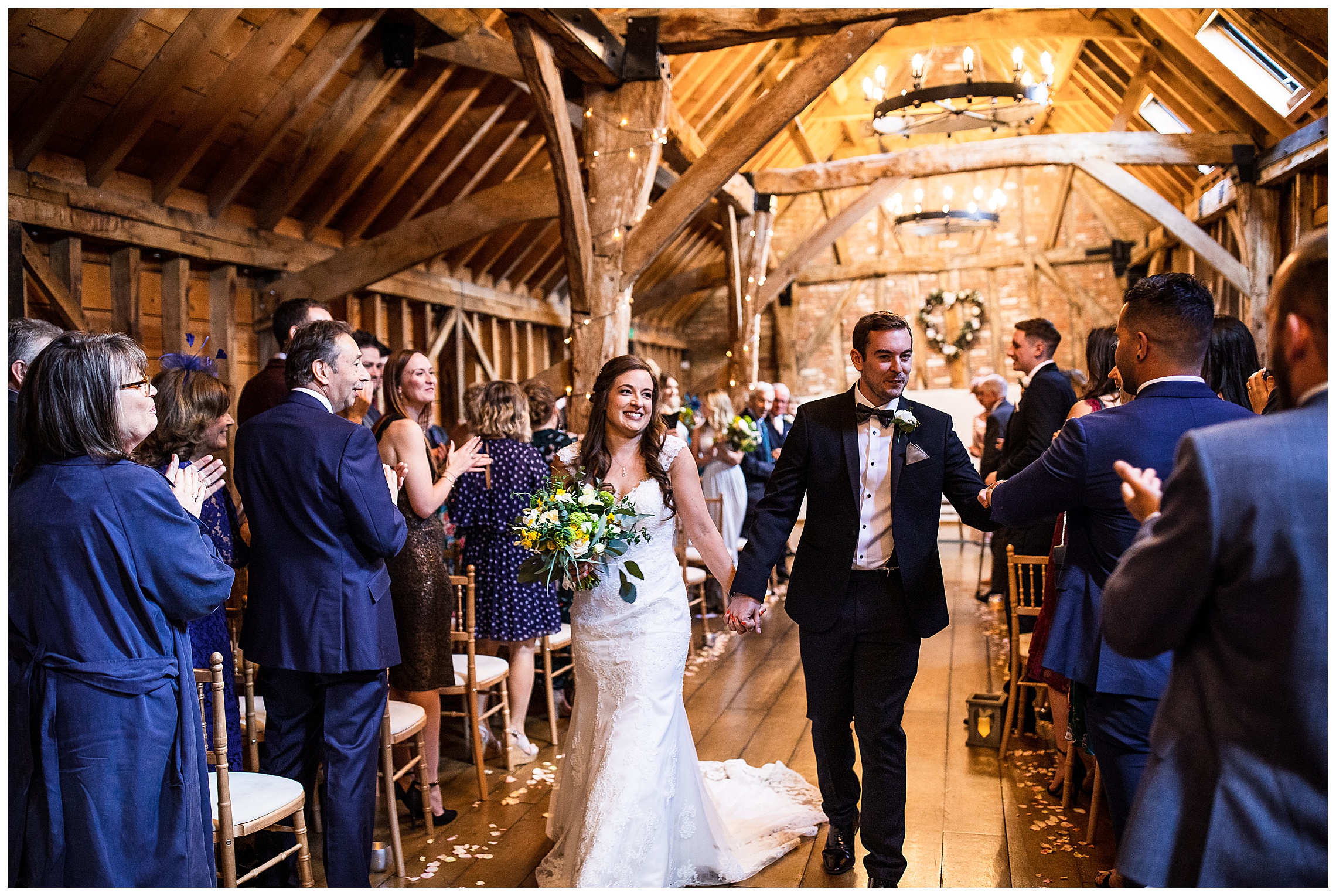 bride and groom walking out of rickety barn at bassmead