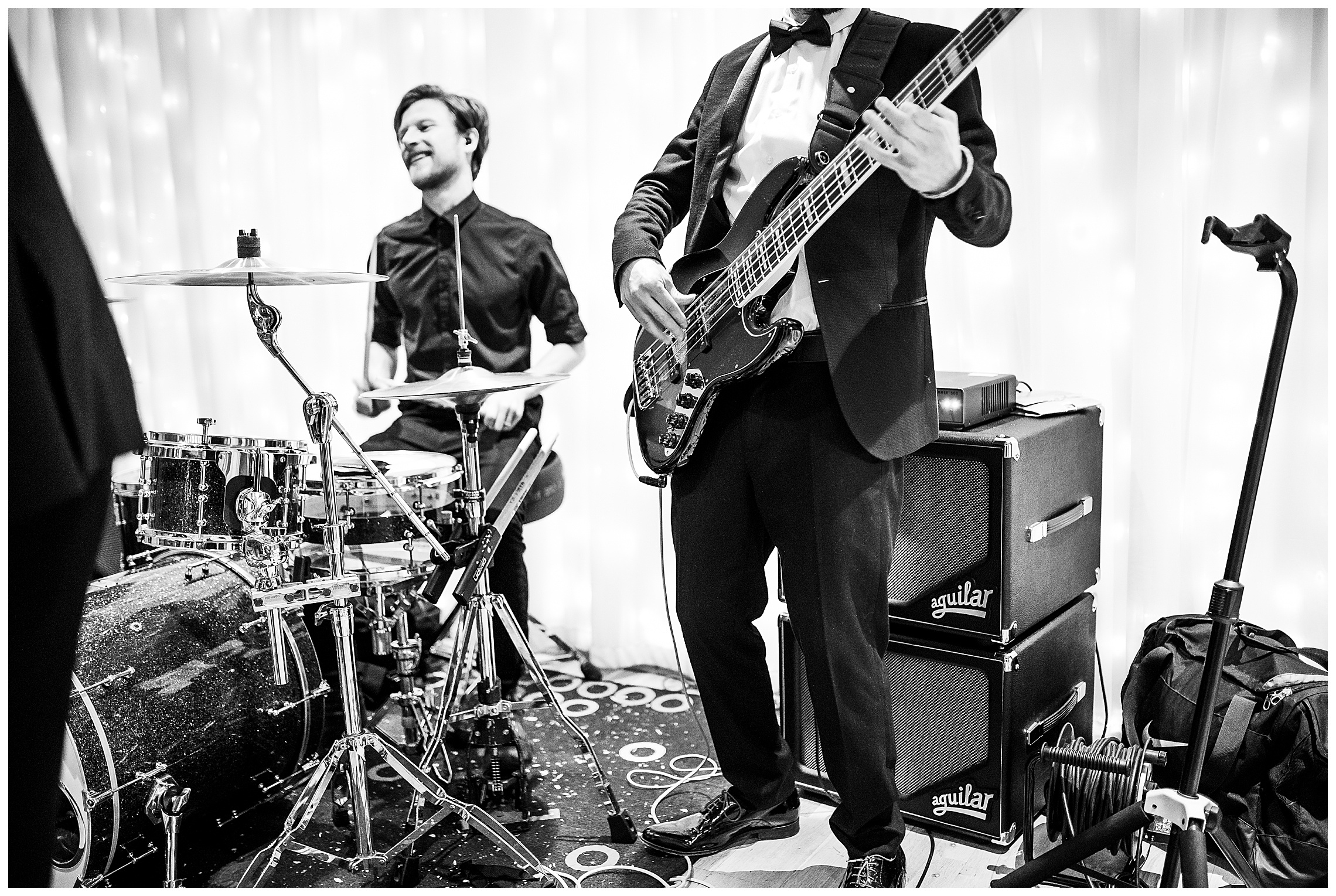 Black and white image of guitarist playing at bassmead manor barns wedding venue