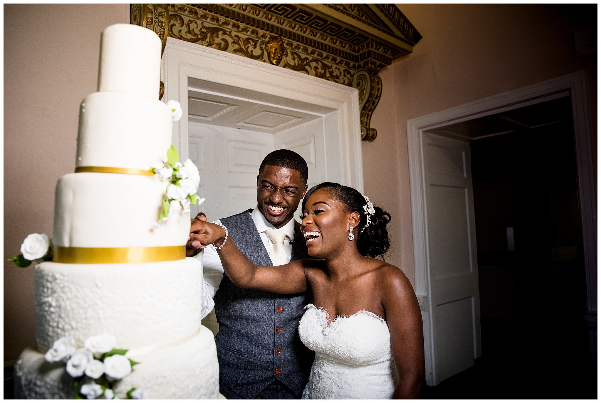 bride and groom cutting 6 tier cake at stowe park