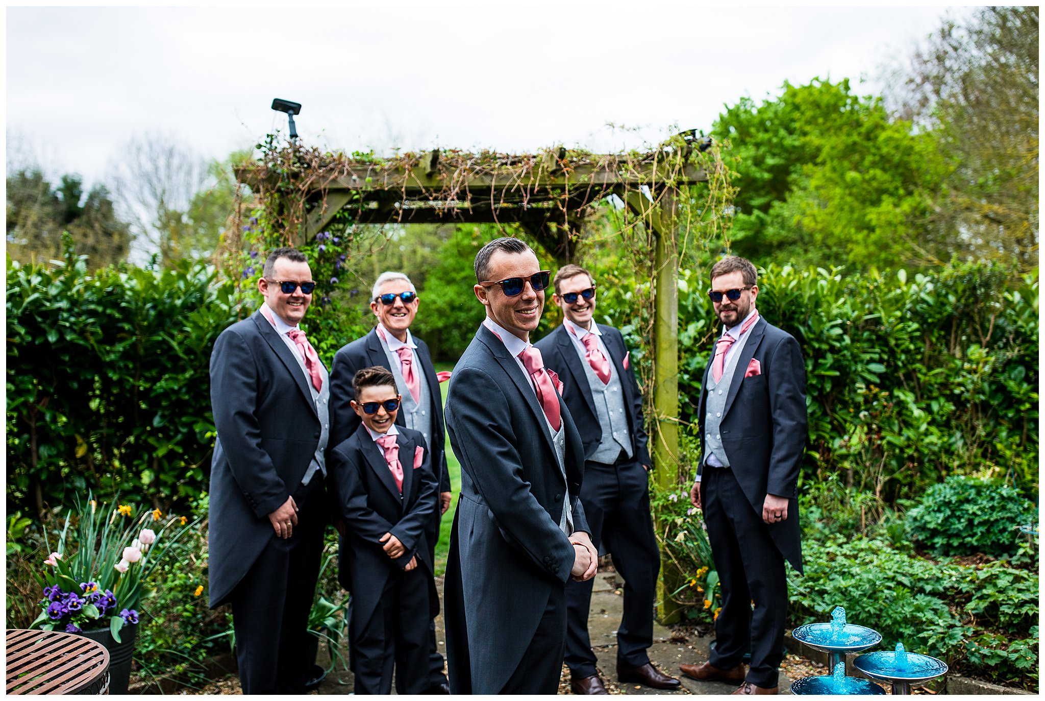 groomsmen in tailed suits