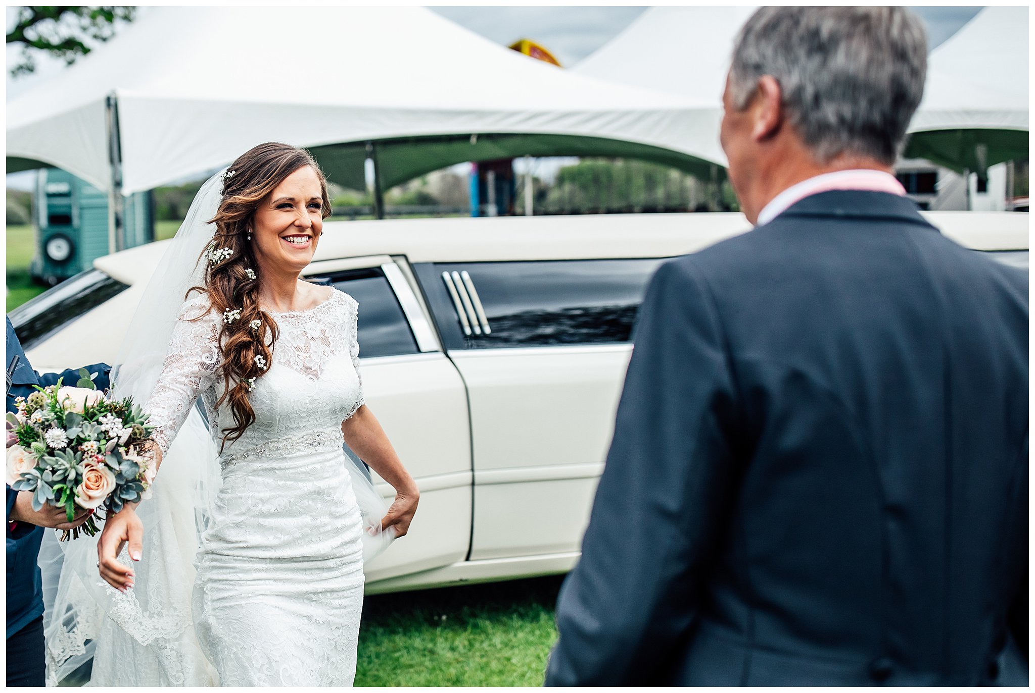 bride confronting brides father smiling excitedly
