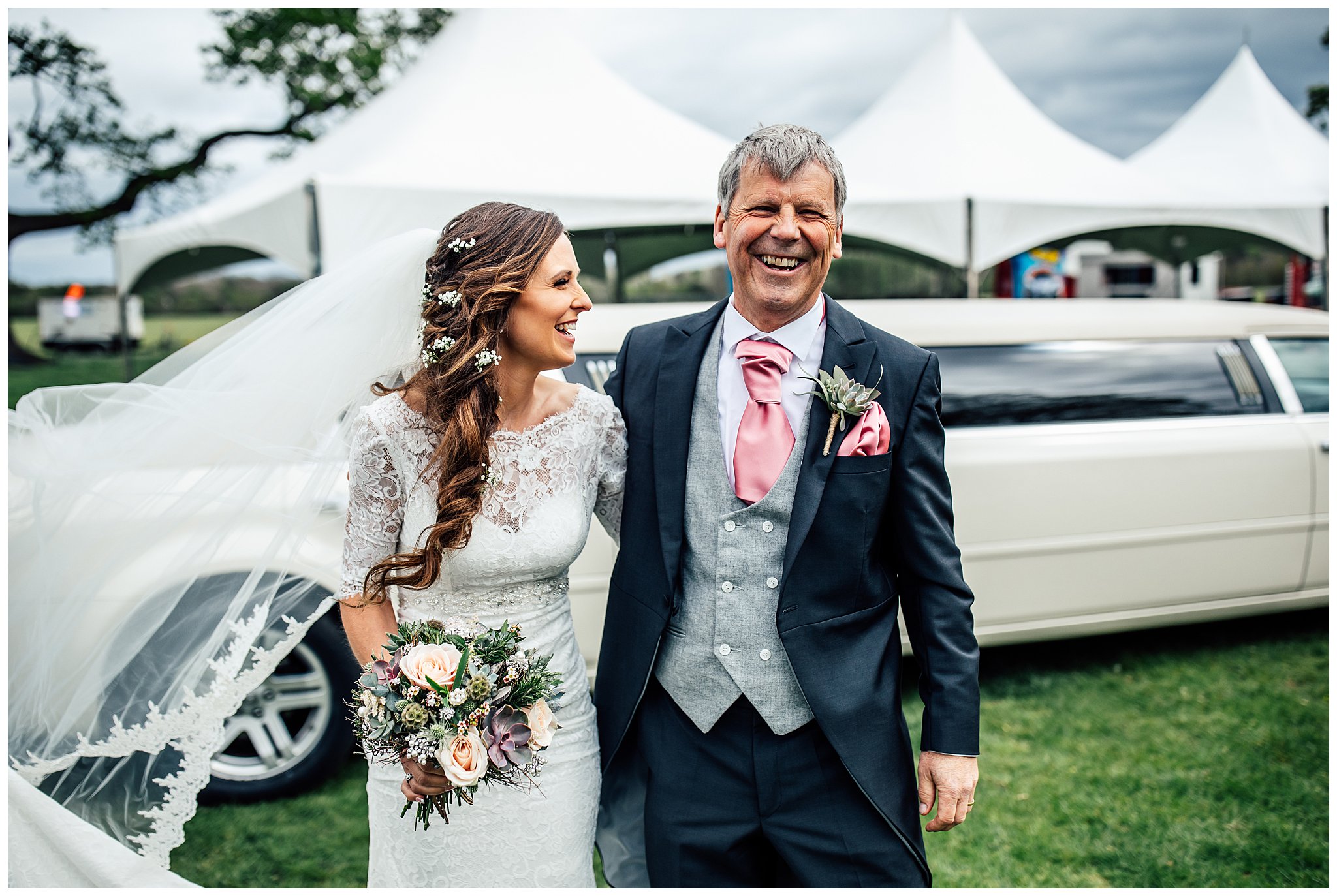 bride and father of the bride laughing together outside