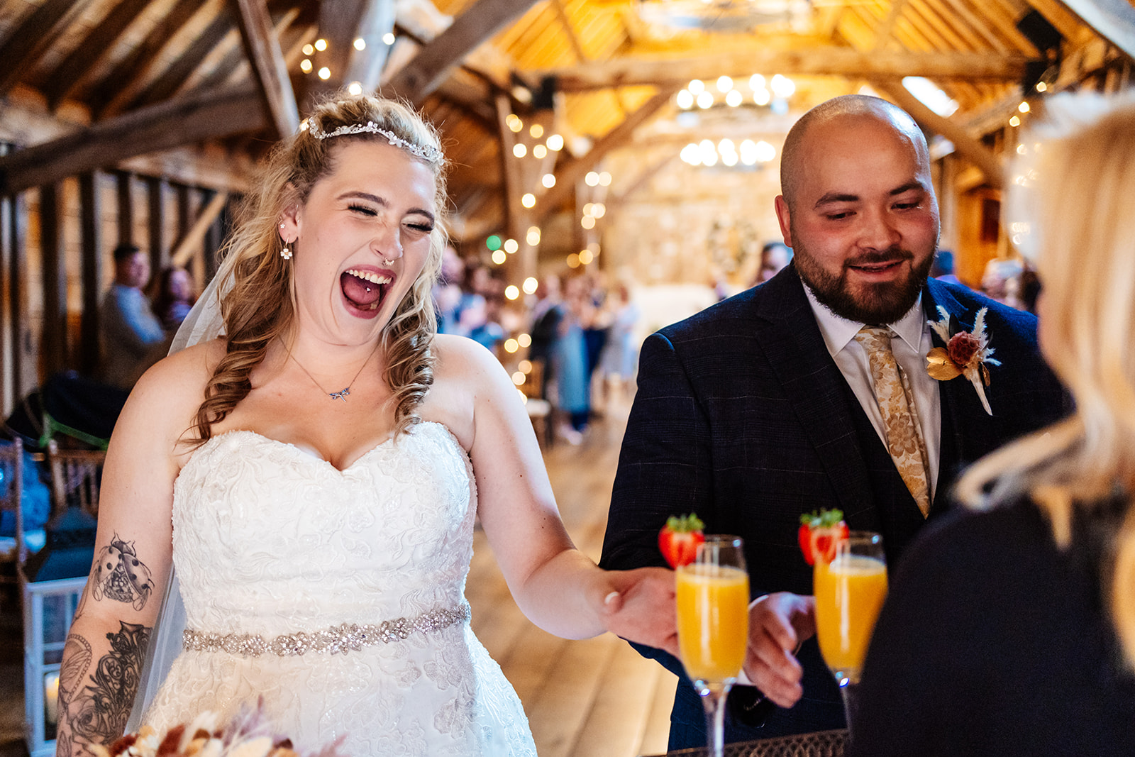 Couple exit the ceremony and are passed a cocktail 