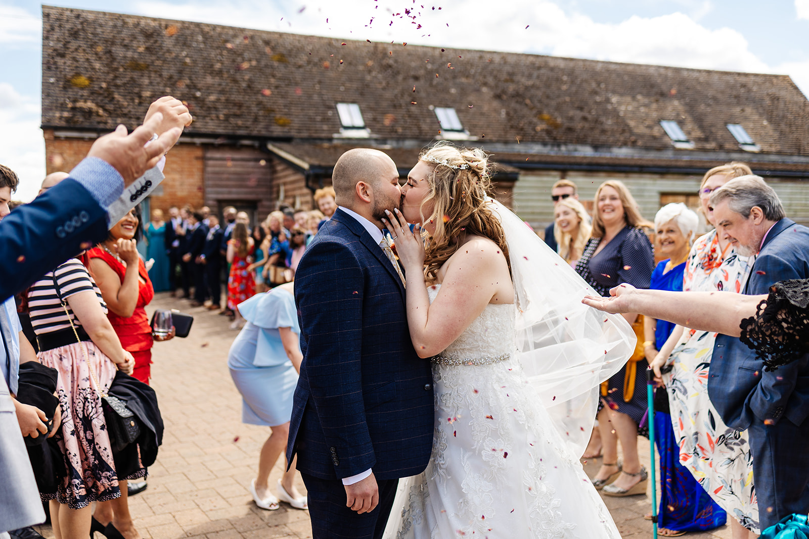 Couple share kiss under confetti 