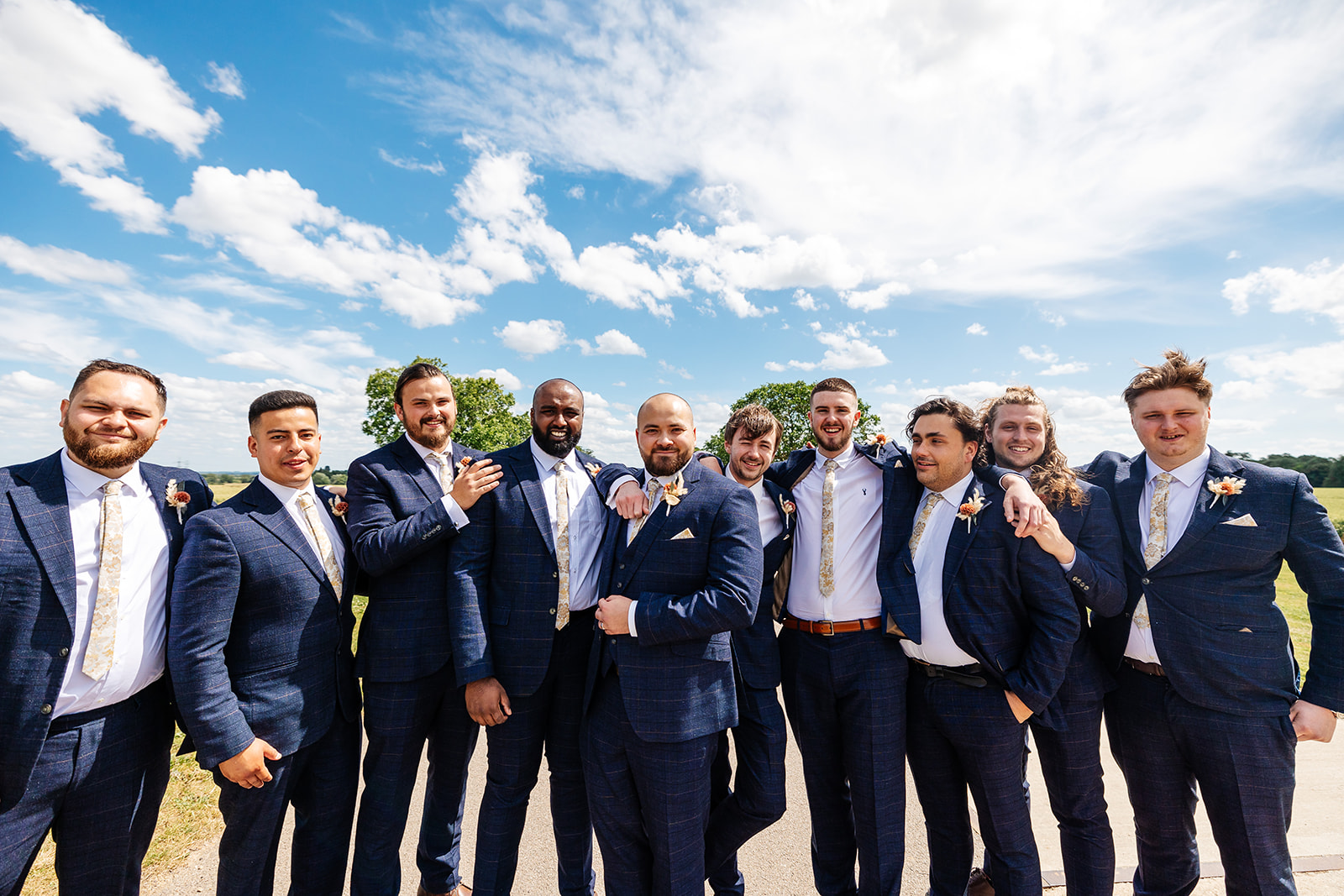 Groomsmen group shot outside 