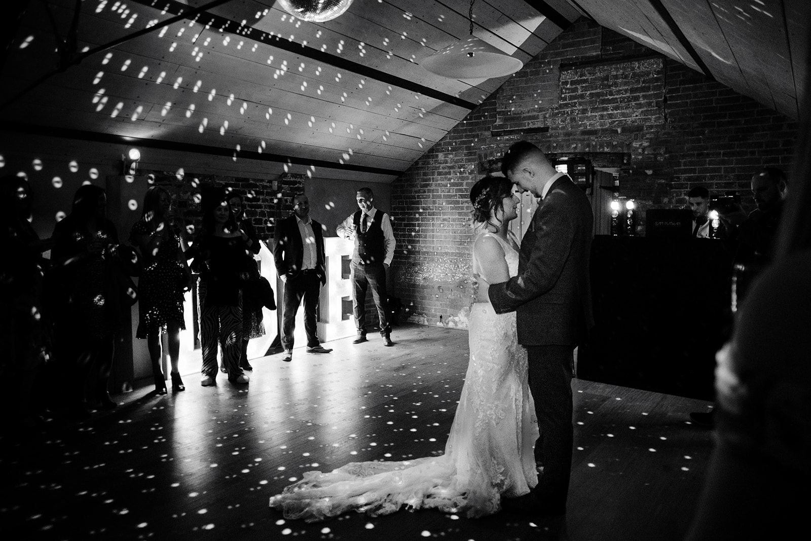 Couples first dance in black and white