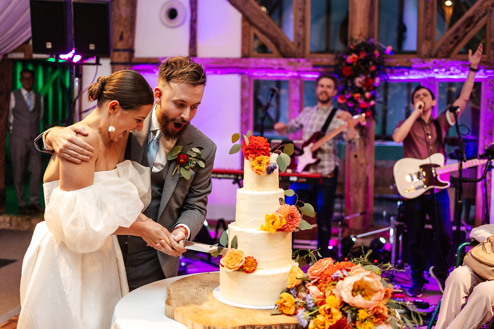 Couple cutting cake